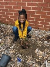 Elementary student in the Ag Exploration Garden