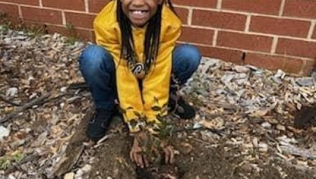 Elementary student in the Ag Exploration Garden