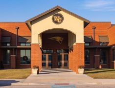 Front entrance of a Wilcox County school building in the morning